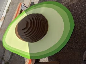 a large avocado sculpture made of wood on the laser cutter by using a 3d printer slicer program. Made at Fuse 33 Makerspace using a Thunder Laser laser cutter machine.