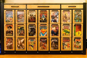 a custom made laser cut wooden cabinet with drawer that are clear to display an extensive comic book collection. Made on a Thunder laser laser cutter machine