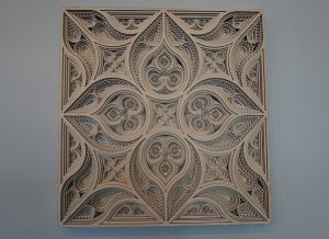 a multi layered wood laser cut mandala created with a Thunder Laser machine