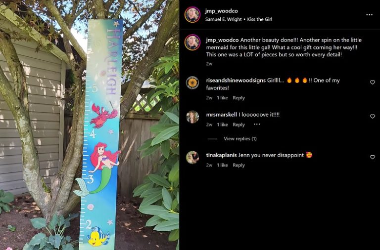 a screenshot of an instagram post by JMP Wood Co. A wooden size chart that looks like a large ruler made for a child. Paintings of the little mermaid character and Flounder