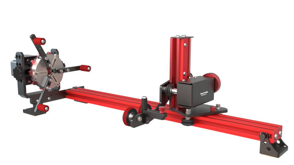 product image of a PiBurn grip rotary for a laser engraver. a red machine made of metal with a rail that allows cylindrical objects to be engraved. the machine has a chuck style attchment to grip objects
