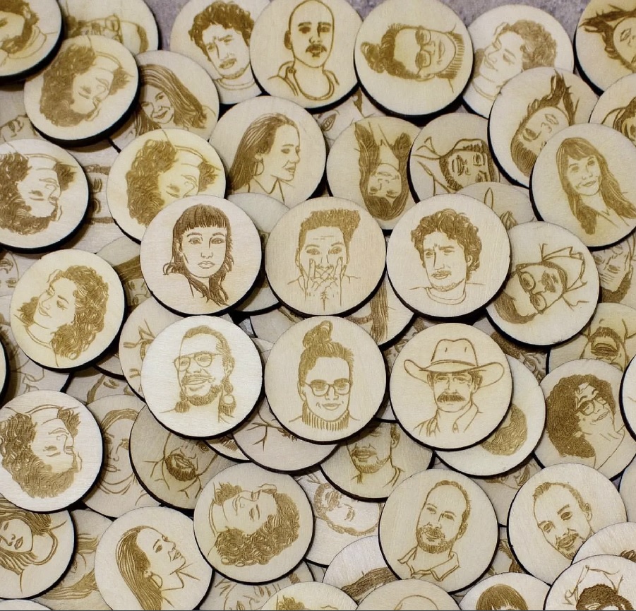 faces of people laser etched on wood circles using a laser cutter by Thunder Laser Canada