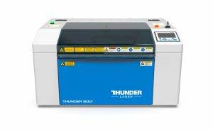 desktop laser cutter by Thunder Laser- the Thunder Bolt. A blue and white laser cutter machine