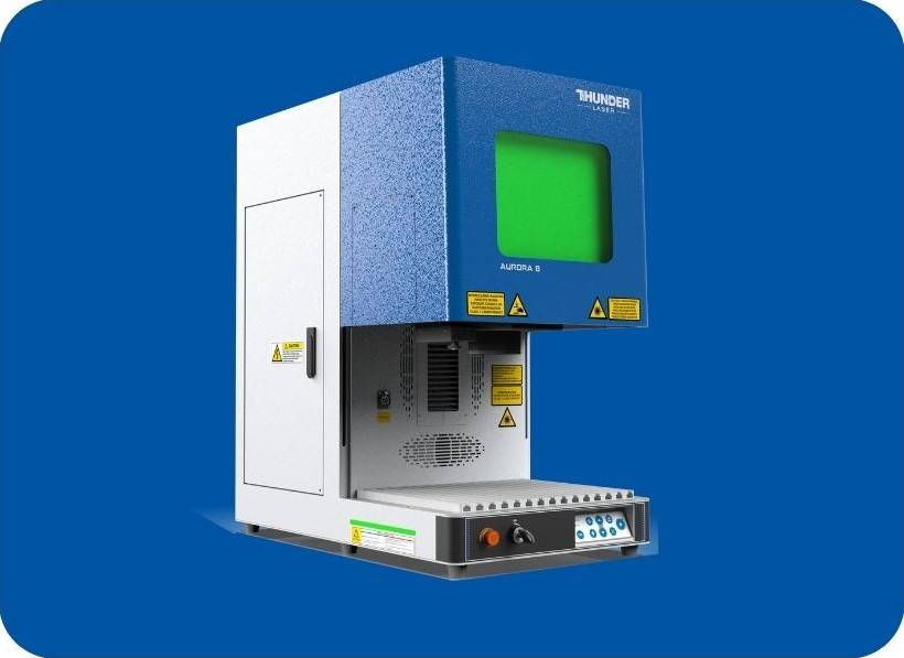 Aurora marking machine laser engraver. Thunder laser product shot. tall blue and white metal laser machine with a green glass window