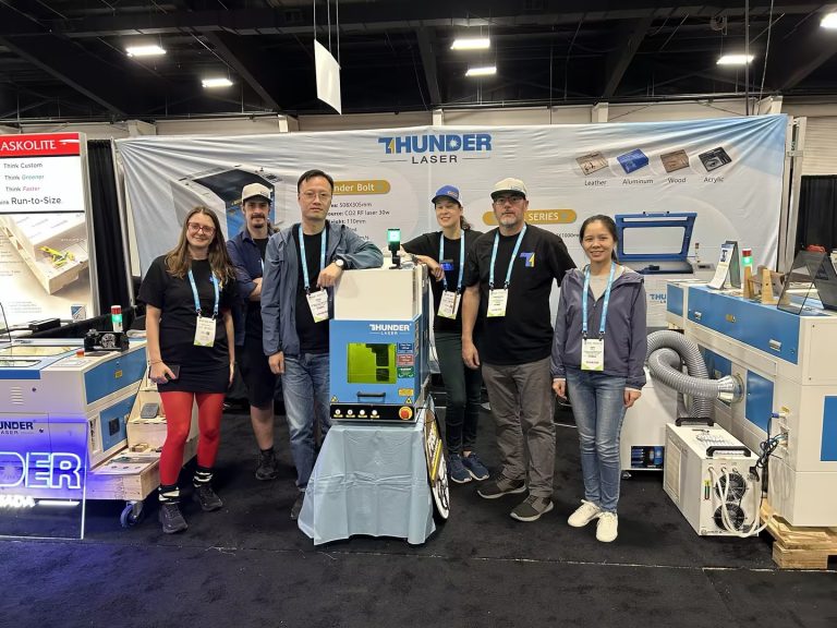 group photo of thunder laser team at the sign expo