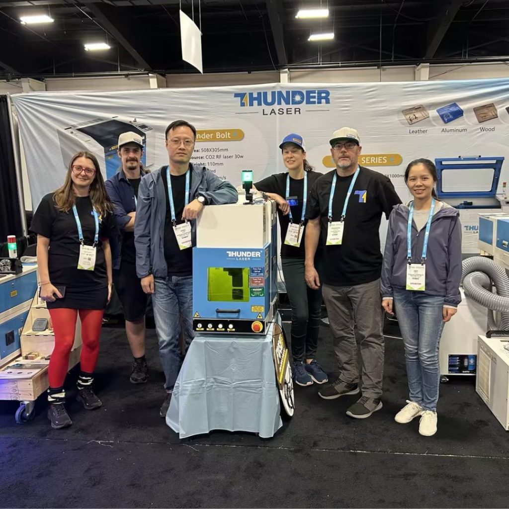 group photo of thunder laser team at the sign expo