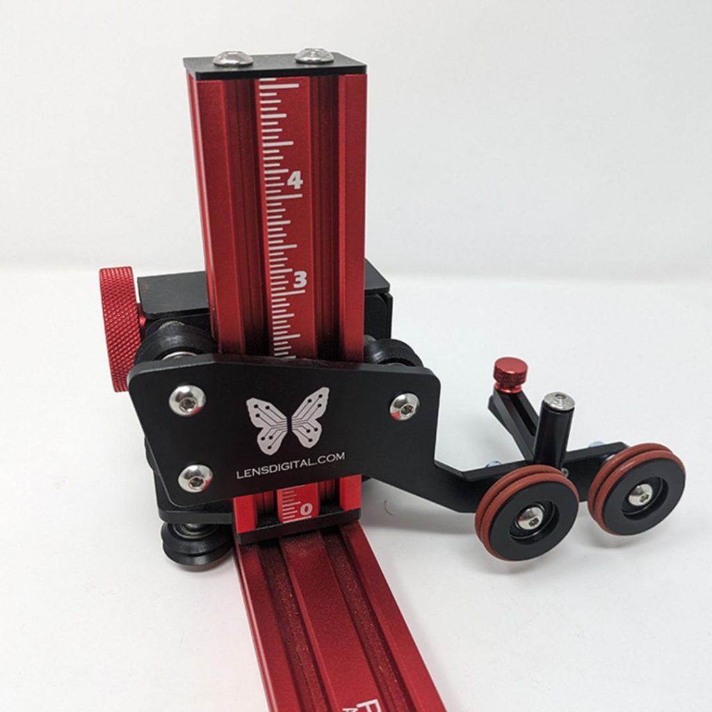 Product shot closeup of the back side of the rotary and its up and down adjustment features and rollers.