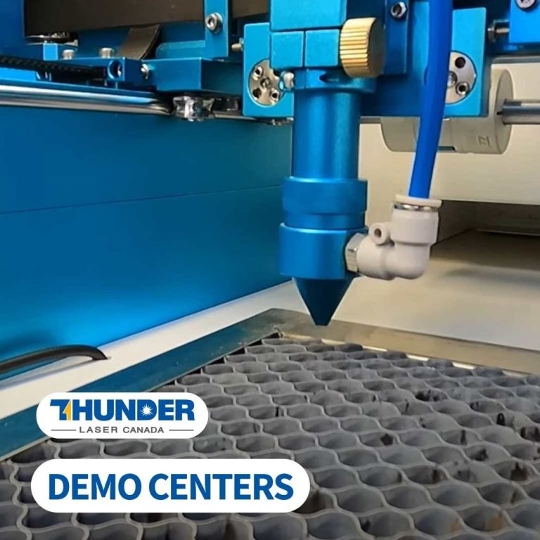 A close up of a laser cutter inside the bed with Thunder Laser Demo centers written on the image in blue letters with white background