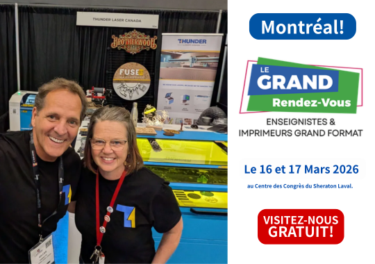 gilles and katy stand with lanyards infront of a blue and white metal thunder laser machine